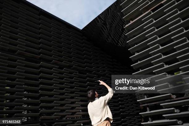 Invited guests walk around the Summer Pavilion at The Serpentine Gallery on June 11, 2018 in London, England. The new pavilion was designed by...