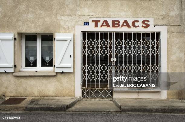 This photo taken on June 10, 2018 shows a previously closed tabacoo store in the village of Villenouvelle in the department of Haute-Garonne, France.