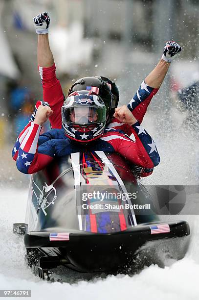 Celebrates after winning the gold medal during the men's four man bobsleigh on day 16 of the 2010 Vancouver Winter Olympics at the Whistler Sliding...