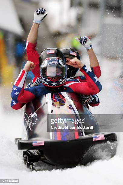 Celebrates after winning the gold medal during the men's four man bobsleigh on day 16 of the 2010 Vancouver Winter Olympics at the Whistler Sliding...