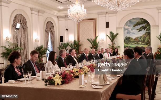 In this handout provided by the Singapore's Ministry of Communications and Information shows U.S. President Donald Trump , Michael Pompeo , John...