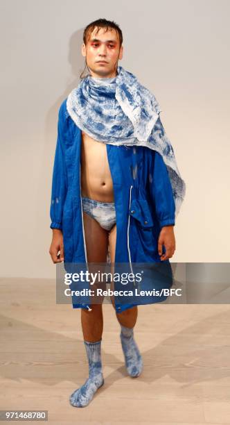 Model poses at the Ka Wa Key DiscoveryLAB during London Fashion Week Men's June 2018 at the BFC Show Space on June 11, 2018 in London, England.