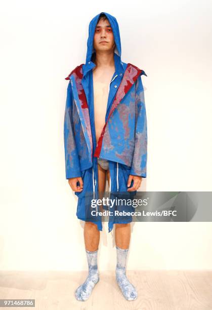 Model poses at the Ka Wa Key DiscoveryLAB during London Fashion Week Men's June 2018 at the BFC Show Space on June 11, 2018 in London, England.