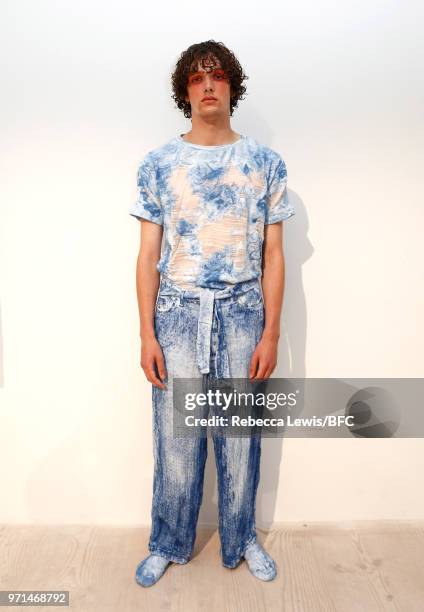 Model poses at the Ka Wa Key DiscoveryLAB during London Fashion Week Men's June 2018 at the BFC Show Space on June 11, 2018 in London, England.