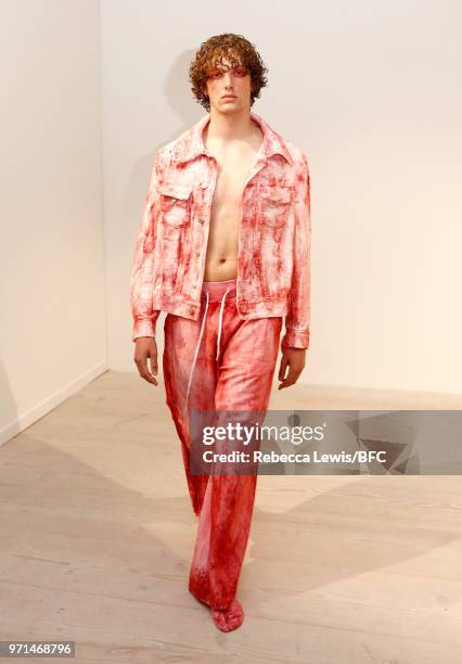 Model poses at the Ka Wa Key DiscoveryLAB during London Fashion Week Men's June 2018 at the BFC Show Space on June 11, 2018 in London, England.