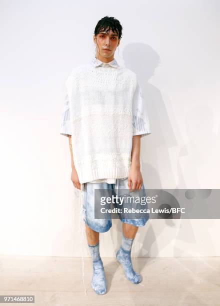 Model poses at the Ka Wa Key DiscoveryLAB during London Fashion Week Men's June 2018 at the BFC Show Space on June 11, 2018 in London, England.