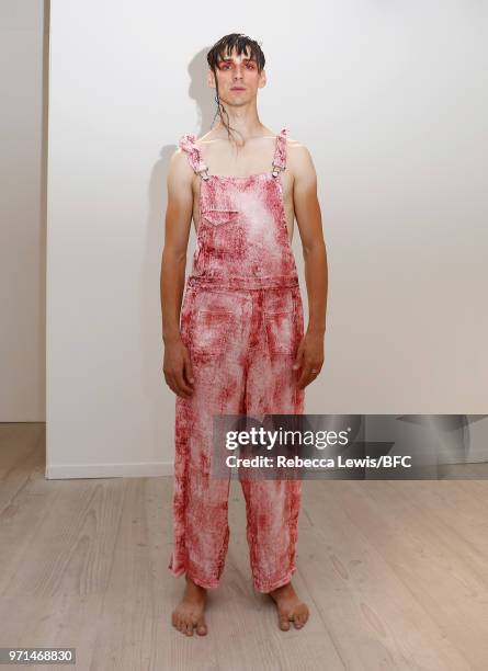 Model poses at the Ka Wa Key DiscoveryLAB during London Fashion Week Men's June 2018 at the BFC Show Space on June 11, 2018 in London, England.