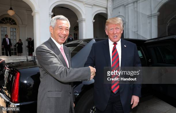 In this handout provided by the Ministry of Communications and Information of Singapore, U.S. President Donald Trump with Singapore's Prime Minister...
