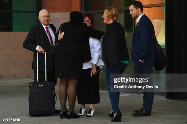 Christine Burke greets supporters as she attend the Hillsborough case hearing at Preston Crown Court on June 11, 2018 in Preston, England. David...