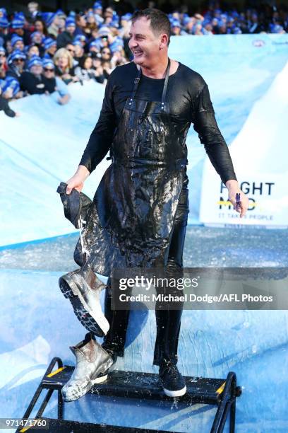 Dockers head coach Ross Lyon reacts after he goes down the MND slide during the round seven AFL match between the Western Bulldogs and the Gold Coast...