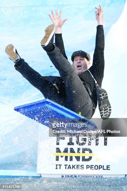 Dockers head coach Ross Lyon goes down the MND slide during the round seven AFL match between the Western Bulldogs and the Gold Coast Suns at Mars...