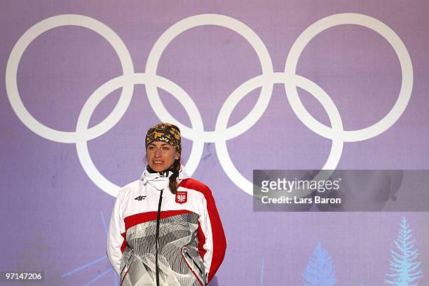 Justyna Kowalczyk of Poland celebrates Gold during the medal ceremony for the Ladies Cross Country 30 km Mass Start Classic during the medal ceremony...