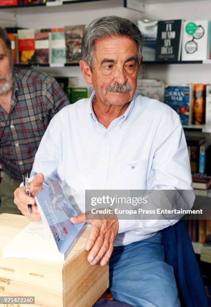 Miguel Angel Revilla signs copies of his book during Madrid Book Fair on June 9, 2018 in Madrid, Spain.