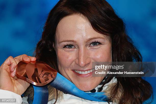 Aino-Kaisa Saarinen of Finland celebrates Bronze during the medal ceremony for the Ladies Cross Country 30 km Mass Start Classic during the medal...