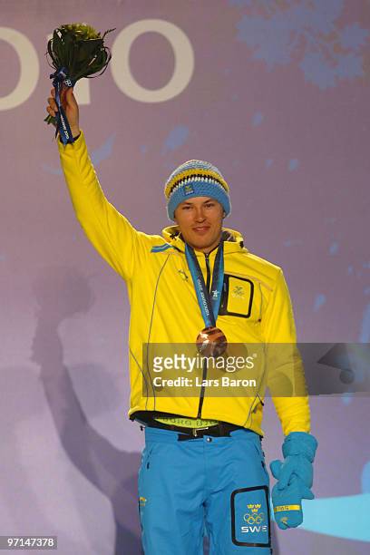 Andre Myhrer of Sweden celebrates Bronze during the medal ceremony for the Alpine Men's Slalom on day 16 of the Vancouver 2010 Winter Olympics at...