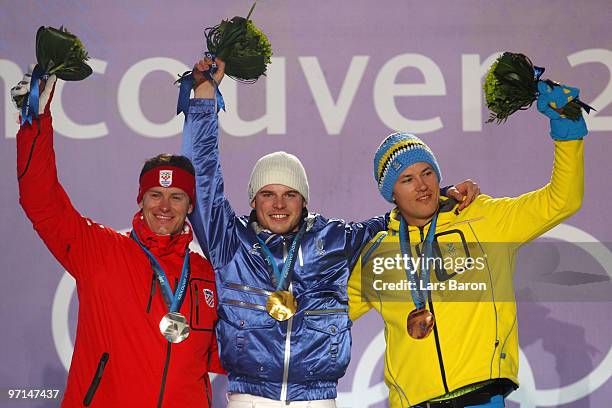 Ivica Kostelic of Croatia celebrates his Silver medal, Giuliano Razzoli of Italy Gold, and Andre Myhrer of Sweden Bronze during the medal ceremony...