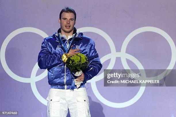 Italy's gold medalist Giuliano Razzoli attends the medal ceremony of the men's Alpine Skiing Slalom at Whistler Medals Plaza on February 27, 2010...