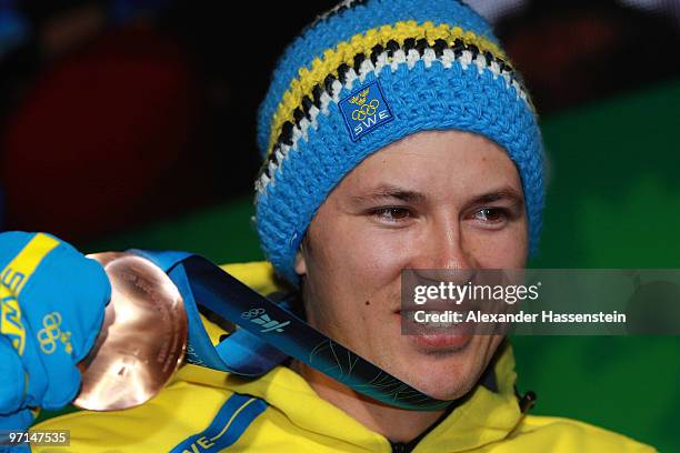 Andre Myhrer of Sweden celebrates Bronze during the medal ceremony for the Alpine Men's Slalom on day 16 of the Vancouver 2010 Winter Olympics at...