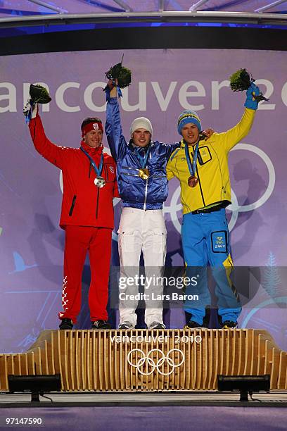 Ivica Kostelic of Croatia celebrates his Silver medal, Giuliano Razzoli of Italy Gold, and Andre Myhrer of Sweden Bronze during the medal ceremony...