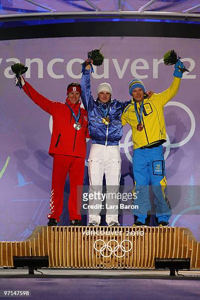 Ivica Kostelic of Croatia celebrates his Silver medal, Giuliano Razzoli of Italy Gold, and Andre Myhrer of Sweden Bronze during the medal ceremony...