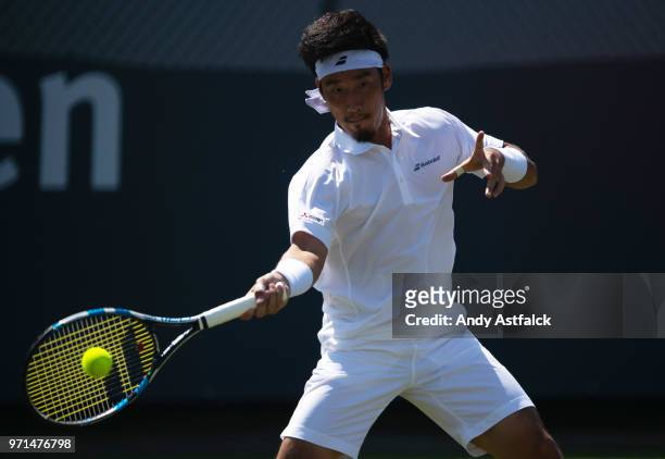 Yuichi Sugita of Japan hits a forehand against Nikoloz Basilashvili of Georgia during Day One of the Libema Open 2018 on June 11, 2018 in Rosmalen,...