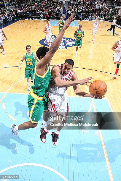 Garrett Temple of the Houston Rockets goes up for the shot against Ronnie Price of the Utah Jazz at EnergySolutions Arena on February 27, 2010 in...