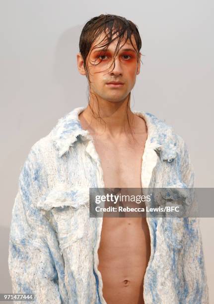 Model poses at the Ka Wa Key DiscoveryLAB during London Fashion Week Men's June 2018 at the BFC Show Space on June 11, 2018 in London, England.