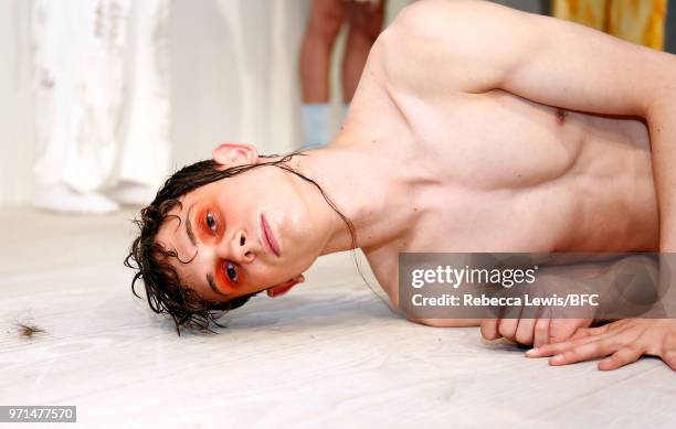 Model poses at the Ka Wa Key DiscoveryLAB during London Fashion Week Men's June 2018 at the BFC Show Space on June 11, 2018 in London, England.