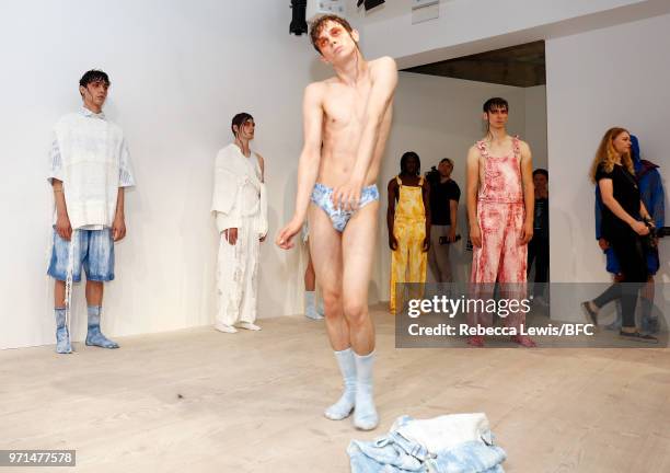 Model poses at the Ka Wa Key DiscoveryLAB during London Fashion Week Men's June 2018 at the BFC Show Space on June 11, 2018 in London, England.