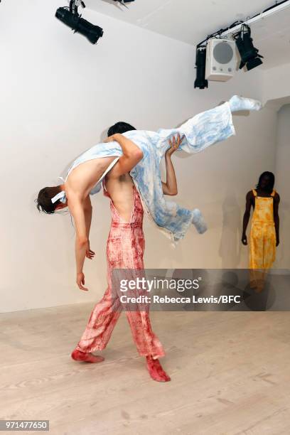 Models pose at the Ka Wa Key DiscoveryLAB during London Fashion Week Men's June 2018 at the BFC Show Space on June 11, 2018 in London, England.