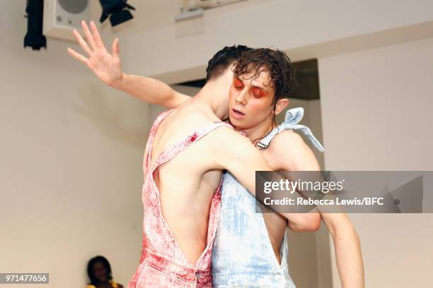 Models pose at the Ka Wa Key DiscoveryLAB during London Fashion Week Men's June 2018 at the BFC Show Space on June 11, 2018 in London, England.