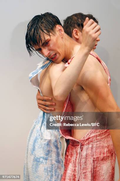 Models pose at the Ka Wa Key DiscoveryLAB during London Fashion Week Men's June 2018 at the BFC Show Space on June 11, 2018 in London, England.