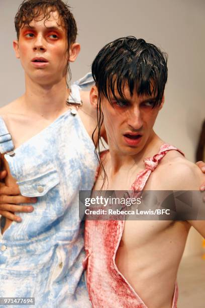 Models pose at the Ka Wa Key DiscoveryLAB during London Fashion Week Men's June 2018 at the BFC Show Space on June 11, 2018 in London, England.