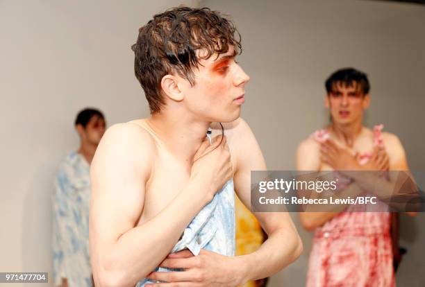 Models pose at the Ka Wa Key DiscoveryLAB during London Fashion Week Men's June 2018 at the BFC Show Space on June 11, 2018 in London, England.