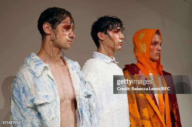 Models pose at the Ka Wa Key DiscoveryLAB during London Fashion Week Men's June 2018 at the BFC Show Space on June 11, 2018 in London, England.