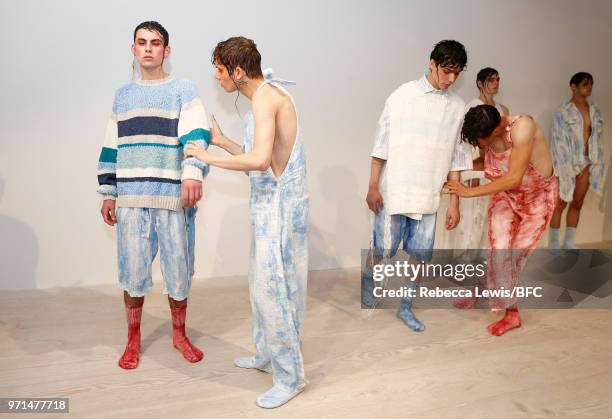 Models pose at the Ka Wa Key DiscoveryLAB during London Fashion Week Men's June 2018 at the BFC Show Space on June 11, 2018 in London, England.