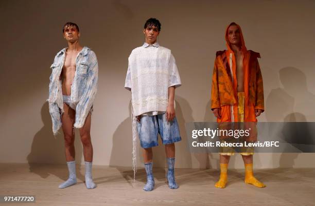 Models pose at the Ka Wa Key DiscoveryLAB during London Fashion Week Men's June 2018 at the BFC Show Space on June 11, 2018 in London, England.