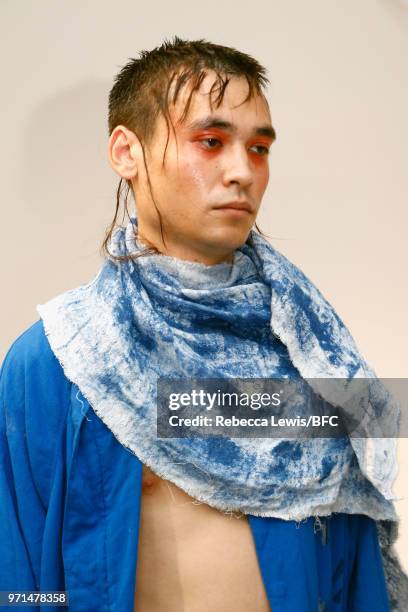 Model poses at the Ka Wa Key DiscoveryLAB during London Fashion Week Men's June 2018 at the BFC Show Space on June 11, 2018 in London, England.