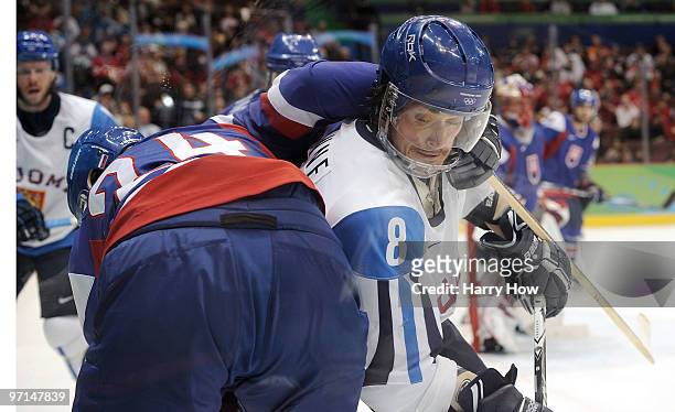 Teemu Selanne of Finland fights for position Zigmund Palffy of Slovakia during the ice hockey men's bronze medal game between Finland and Slovakia on...