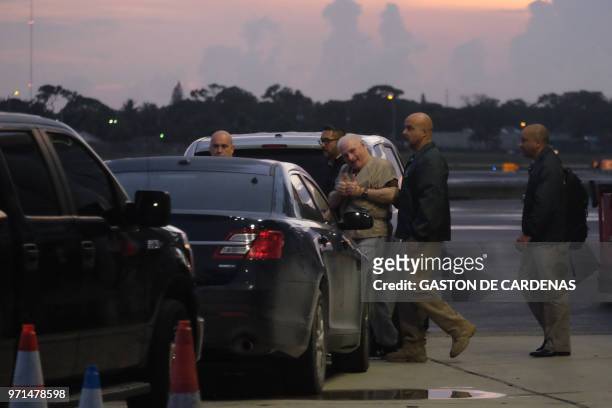 Former Panamanian President Ricardo Martinelli is escorted by US Marshals to an awaiting jet early morning June 11, 2018 at Opa Locka airport near...