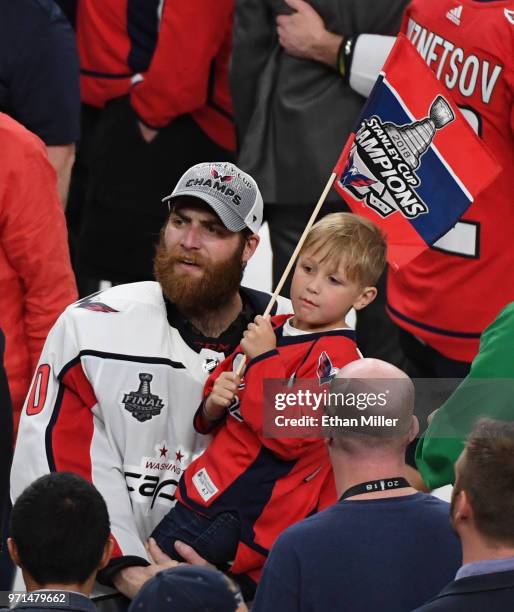 Braden Holtby of the Washington Capitals celebrates on the ice with his son Benjamin Holtby after the Capitals' 4-3 win over the Vegas Golden Knights...