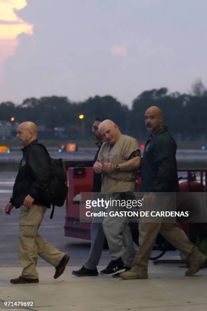 Former Panamanian President Ricardo Martinelli is escorted to a plane by US Marshalls early morning June 11, 2018 at Opa Locka airport near Miami,...