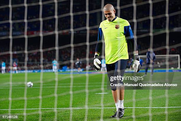 Victor Valdes of FC Barcelona looks on during his warms up before the La Liga match between Barcelona and Malaga at Camp Nou on February 27, 2010 in...