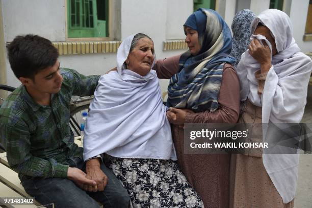 Afghan women weep for their relatives at the Isteqlal Hospital, following a suicide attacker blew himself up among government ministry employees, in...