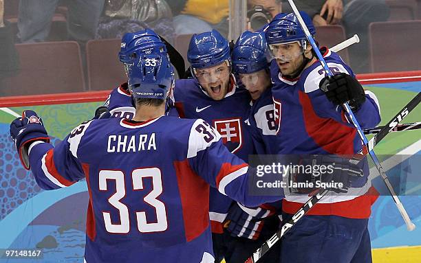 Marian Gaborik of Slovakia celebrates with his team after scoring a goal in the second period during the ice hockey men's bronze medal game between...