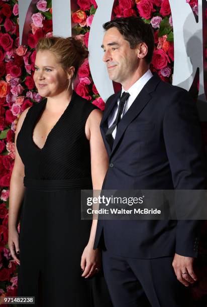 Amy Schumer and Chris Fischer attend attend the 72nd Annual Tony Awards on June 10, 2018 at Radio City Music Hall in New York City.