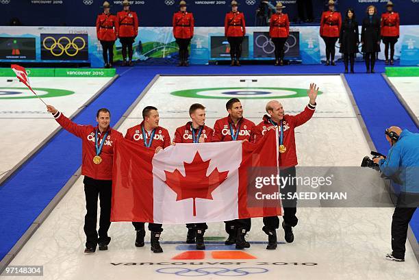 Canada's gold medalists celebrate after the medals ceremony after the Vancouver Winter Olympics men's curling final match at the Vancouver Olympic...