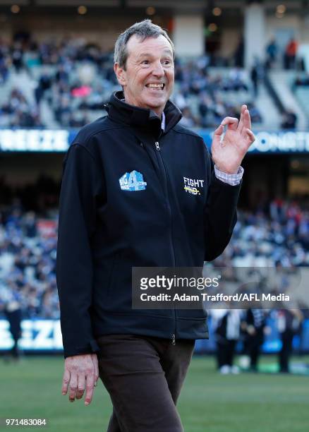 Neale Daniher walks around the ground during the 2018 AFL round 12 match between the Melbourne Demons and the Collingwood Magpies at the Melbourne...