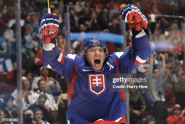 Marian Hossa of Slovakia celebrates after scoring a goal past Miikka Kiprusoff of Finland in the second period during the ice hockey men's bronze...