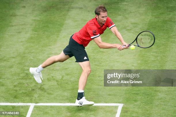 Florian Mayer of Germany plays a backhand to Yannick Maden of Germany during day 1 of the Mercedes Cup at Tennisclub Weissenhof on June 11, 2018 in...